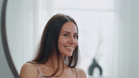 White-teeth-lady-smiling-bathroom-mirror.-Closeup-happy-woman-posing-at-morning