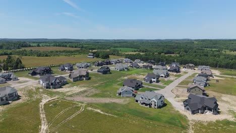 aerial view of new housing development under clear blue sky