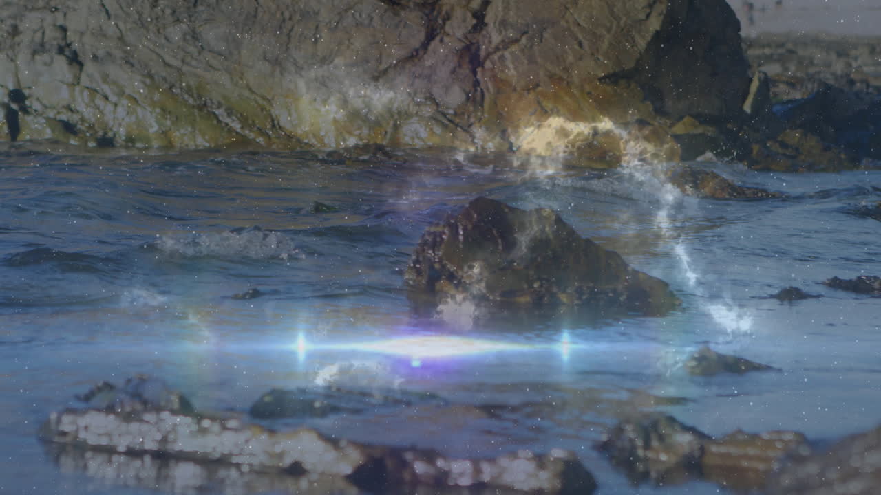 Medium-sized dark rock glinting in water, waves gently lapping around base, flat design animation