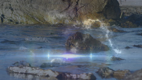 medium-sized dark rock glinting in water, waves gently lapping around base, flat design animation