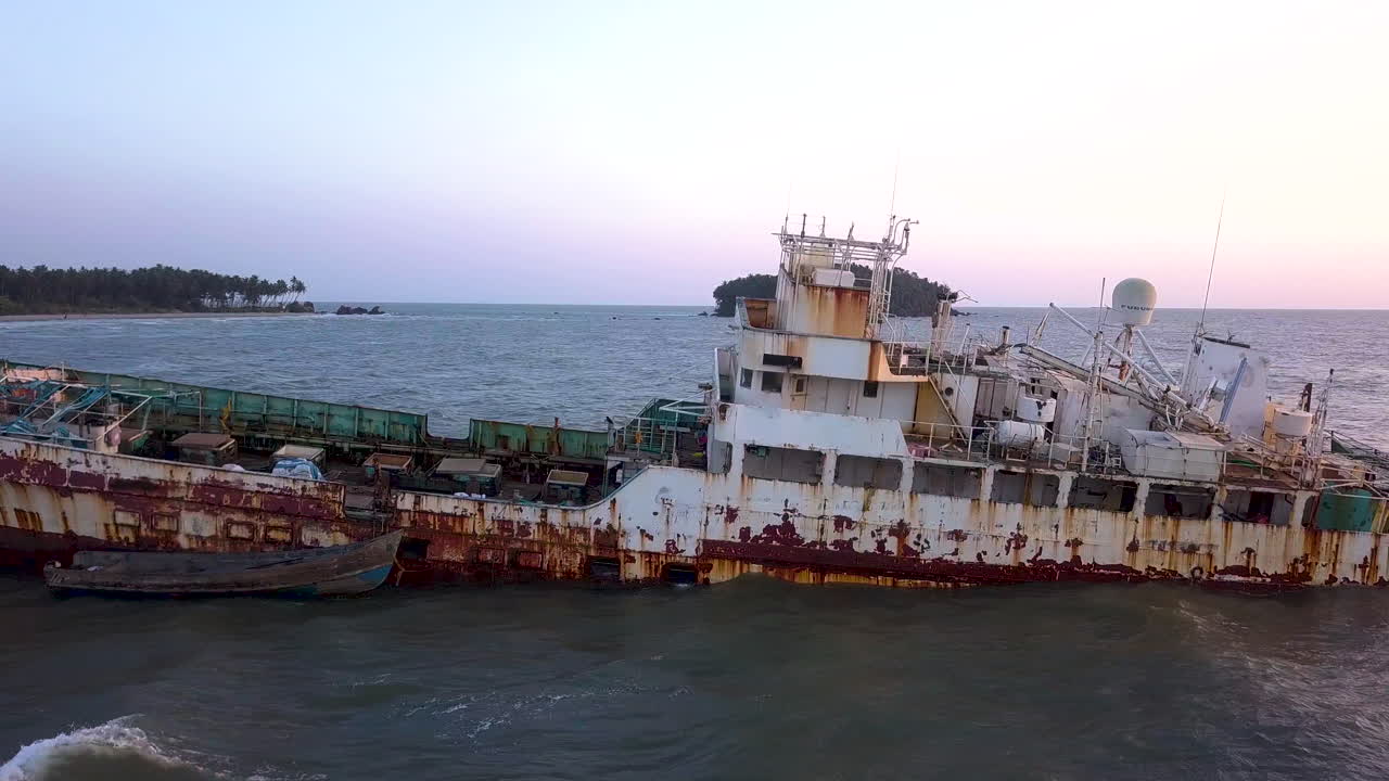 Sideway Back view of wreckage of ship at dusk in Kerala, India
