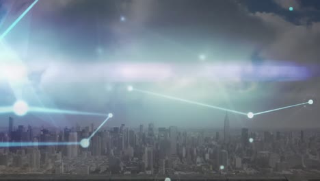 animation of glowing network of connections and light trail against aerial view of cityscape