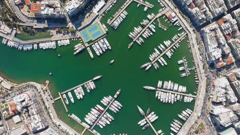 topdown ascending view of marina zeas, yachts moored in the piers, athens