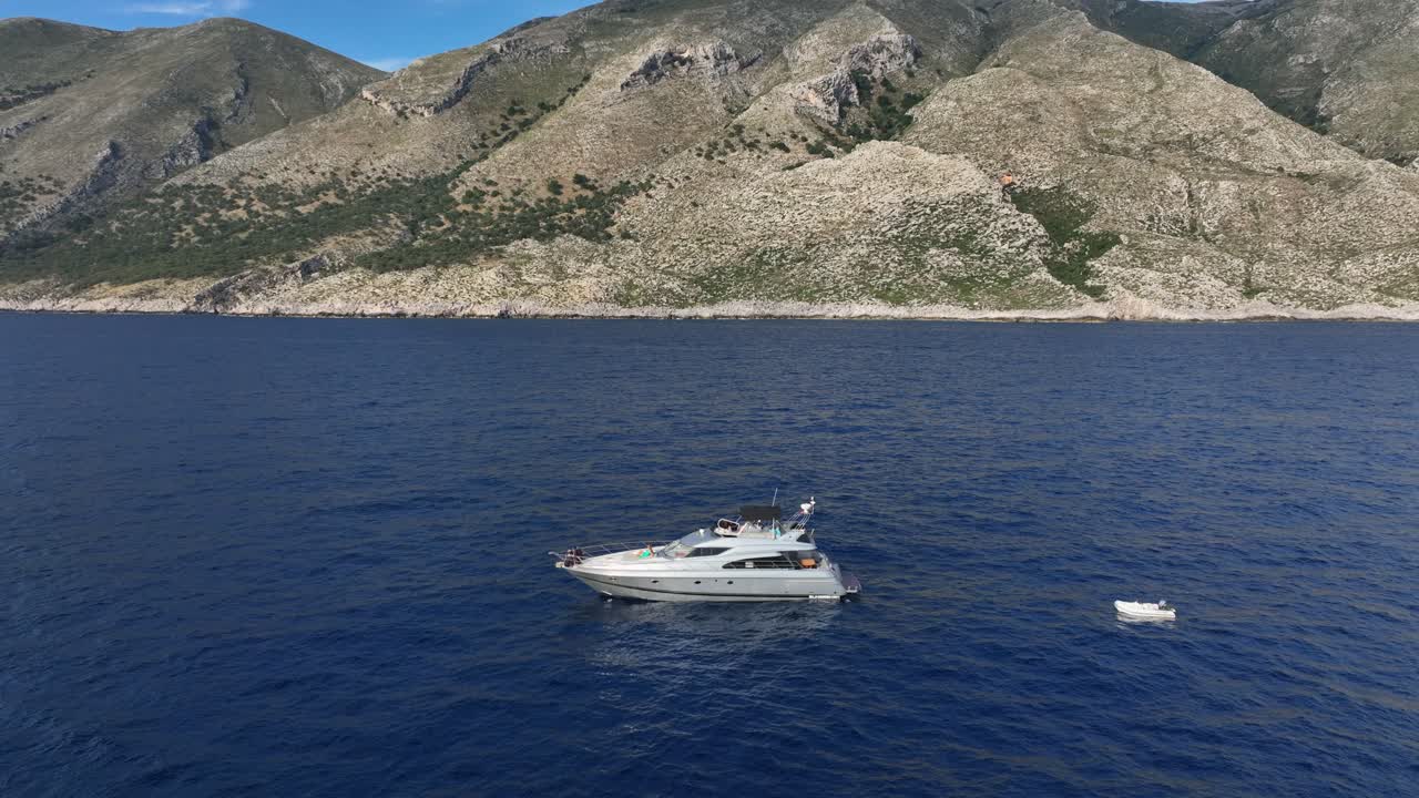 Aerial Pullback Yacht Anchored Beautiful Mountainous Albanian Coast