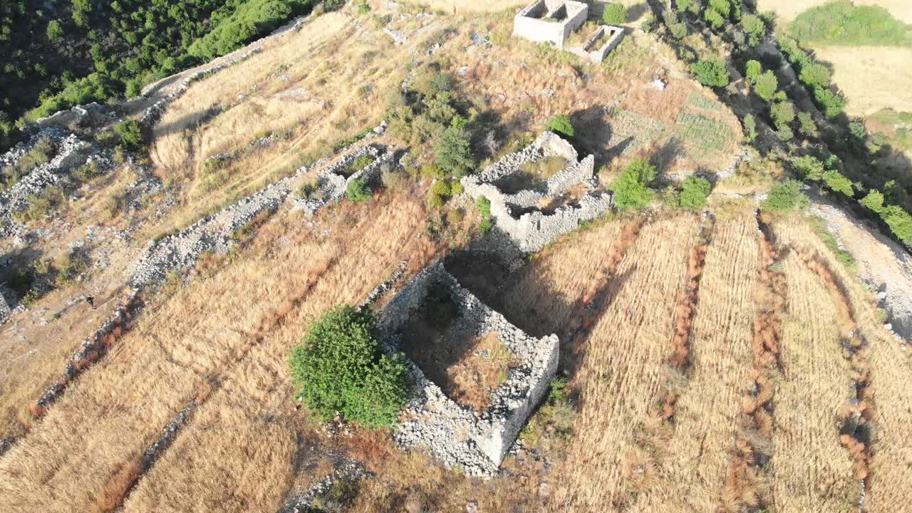 Stunning aerial drone footage reveals the haunting beauty of an abandoned ghost town nestled in Lebanon's majestic mountains.Captures the eerie atmosphere of forgotten stone houses and overgrown paths