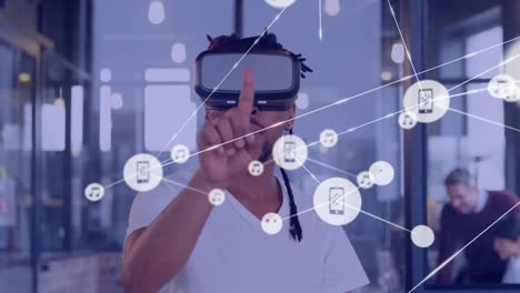 animation of network of connections with icons over biracial businessman using vr headset