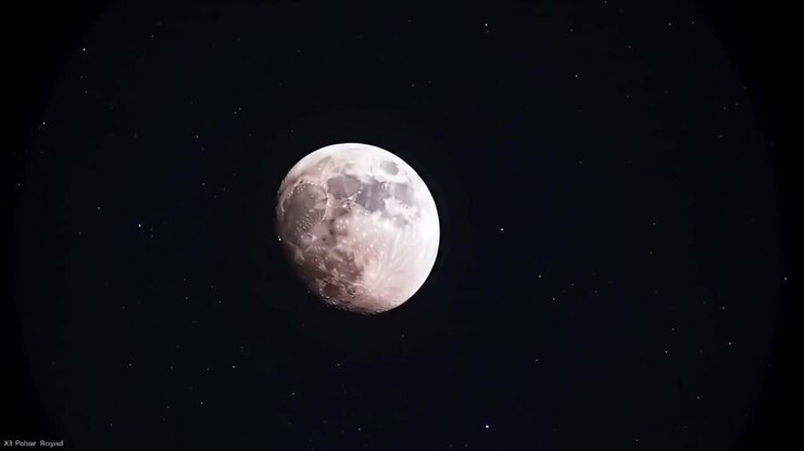 Shining brightly in the night sky, the moon captivates with its intricate details and craters, surrounded by countless stars. This celestial view showcases the universe's breathtaking beauty.