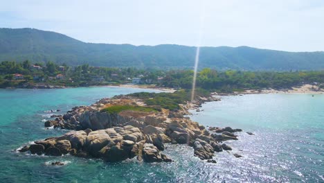 Aerial-drone-clip-over-an-exotic-beach-in-Vourvourou,-Chalkidiki,-Greece