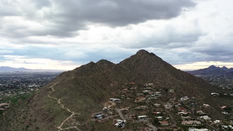 drone shot showcasing large homes built in the shadow of camelback mountain in arizona