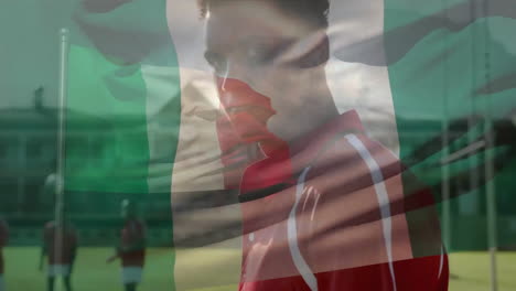 animation of flag of italy over diverse male rugby players