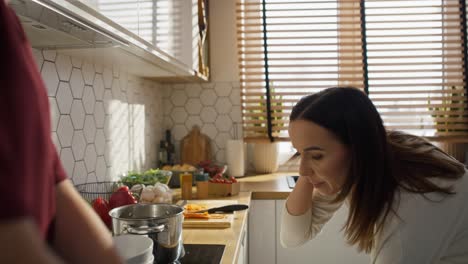 caucasian mom and daughter cooking  and serving soup together