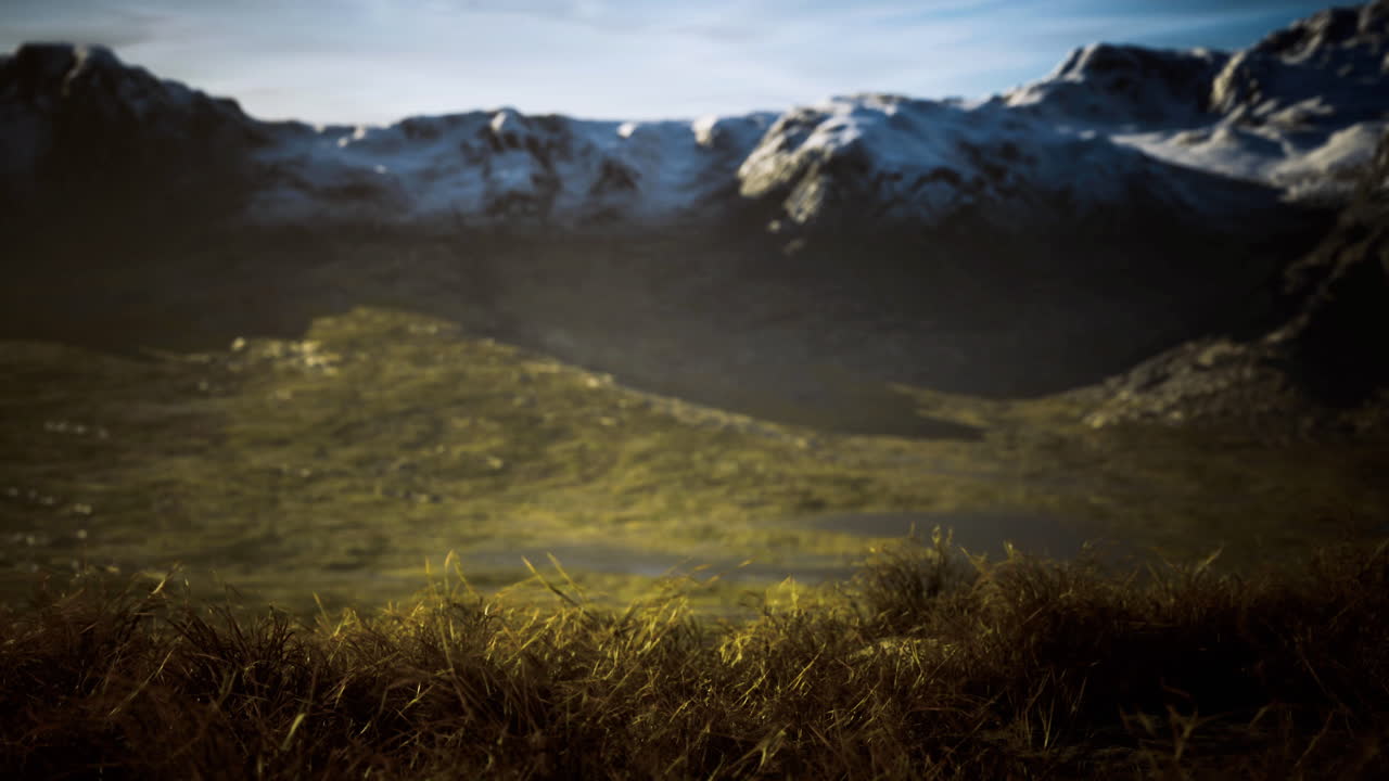 Majestic mountain landscape with lush green valleys and snow capped peaks