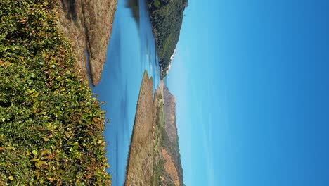 Praia-De-Odeceixe-Mar-Beach-With-Golden-Sand,-Atlantic-Ocean,-River-Bend-and-White-Houses-of-Odeceixe-Village