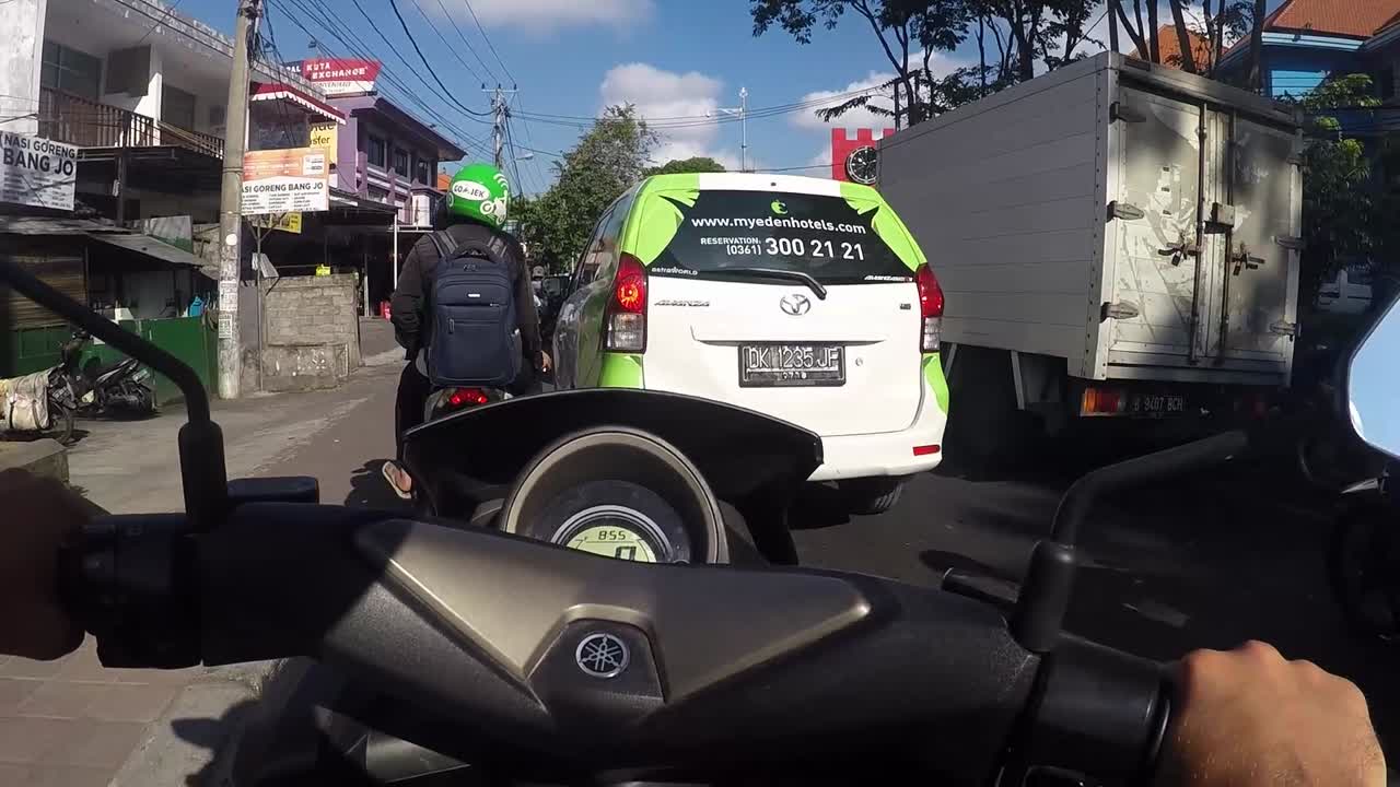Motorcycle POV riding in city traffic