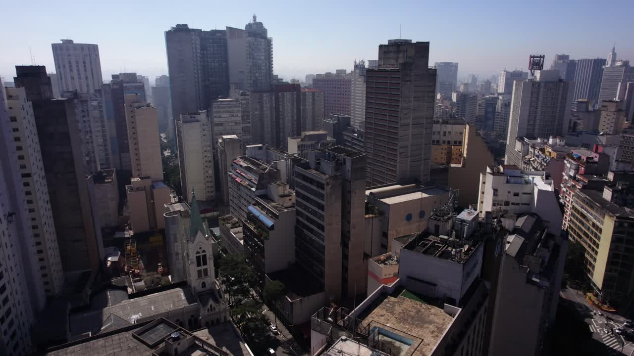 Aerial tilt shot in middle of buidings in sunny Consola&ccedil;&atilde;o, Sao Paulo, Brazil