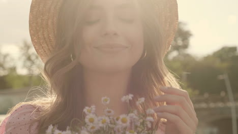 woman in straw hat with flowers