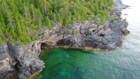 aerial descending shot into small bay cove in georgian bay