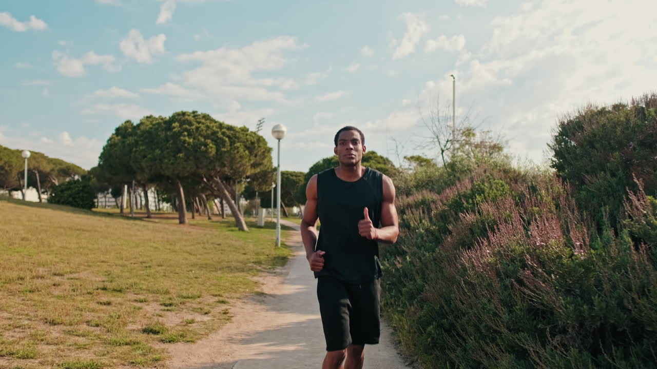 Young Man Jogging in the Park
