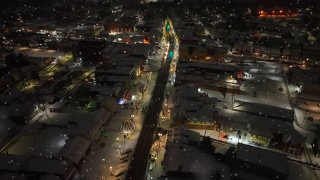 american town main street decorated with festive christmas lights