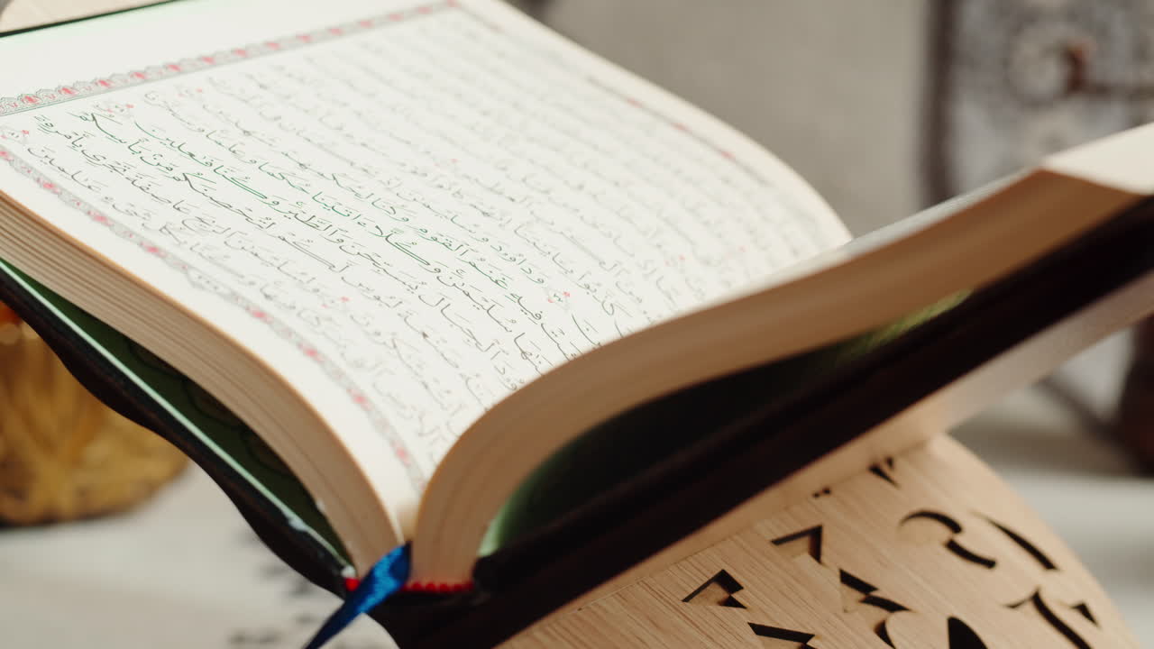 Quran book close-up, praying, islamic religion. Religious holiday Ramadan, holy month. Worship, making traditional prayer to God