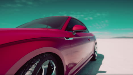 pink convertible sports car in a desert landscape