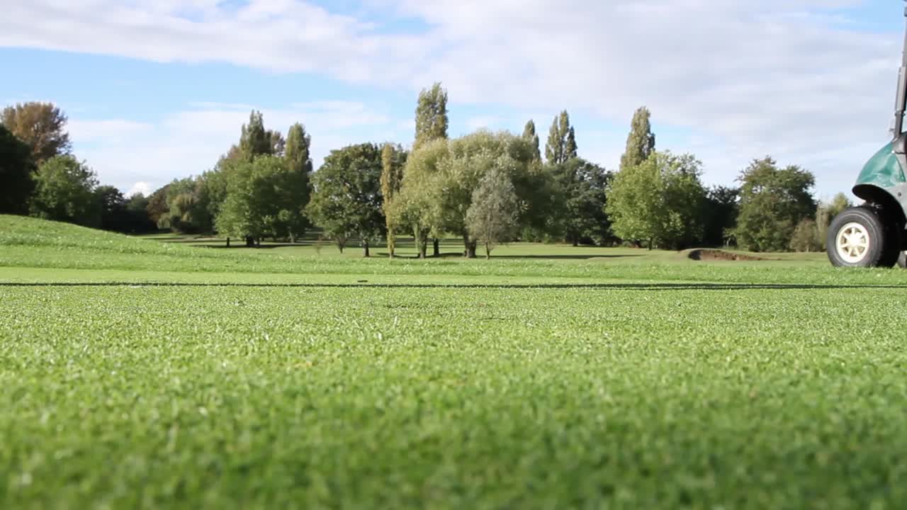 Golfer Walking on Golf Course