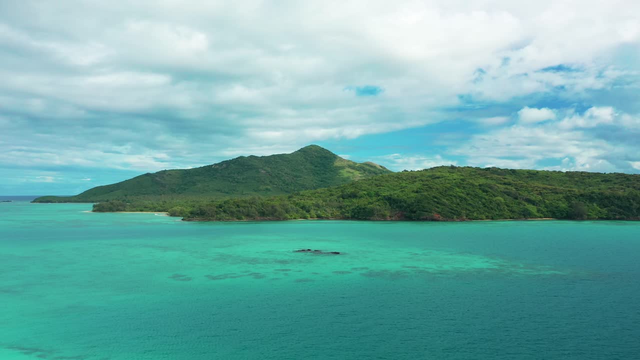 The beautiful, pristine turquoise waves of the Fiji mountain islands - aerial
