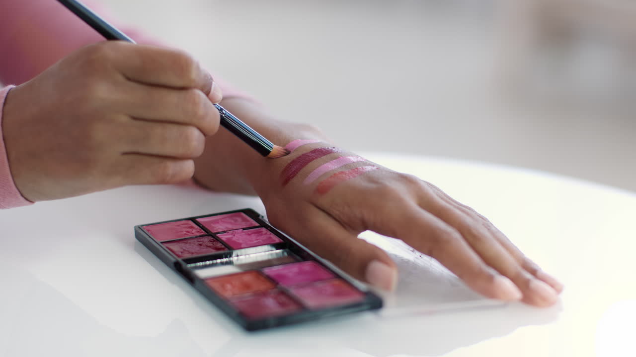 Woman Applying Lipstick Swatches