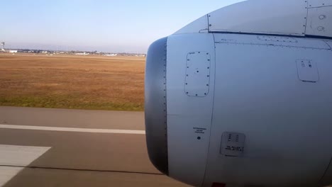 Window-plane-view-on-reactor-and-landfields-during-landing