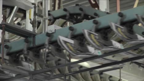 newspapers flow along an assembly line in a newspaper factory 4