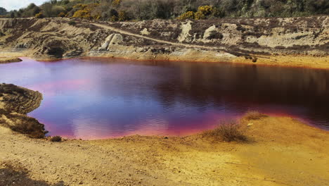 cornish mars - coloured and hazardous waters of wheal maid tailings from mining in cornwall, england