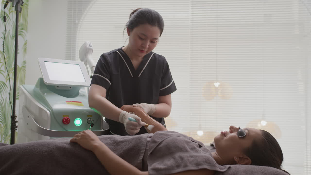 Esthetician Applying Gel on Arms of Woman before Depilation