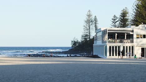 abandoned structure on beach with changing shadows