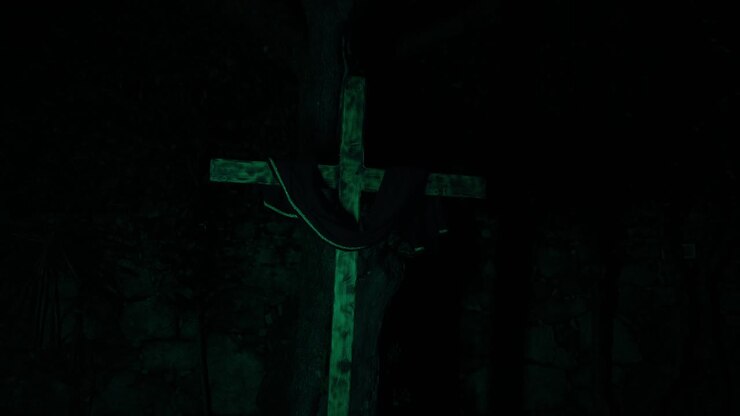 Wooden cross glowing in darkness representing Christianity faith sacrifice and Easter symbolism