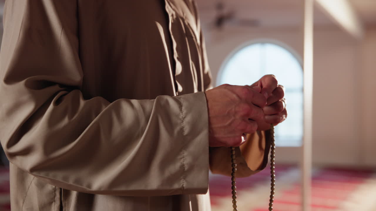 Muslim man praying in a mosque