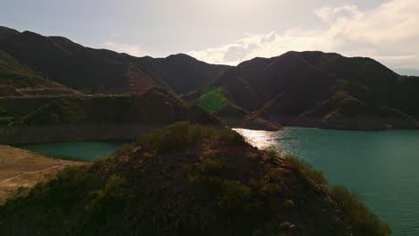 backward-revealing-shot-of-the-stunning-landscape-and-vibrant-lake-in-mendoza