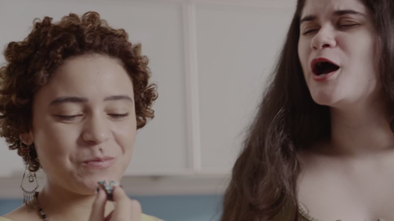 Two Women Enjoying Sweet Treats Together
