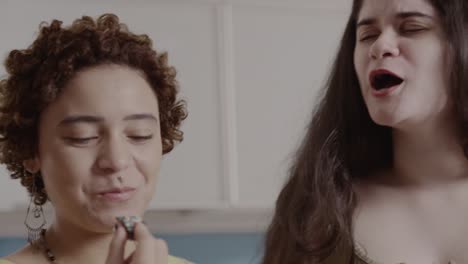 two women enjoying sweet treats together