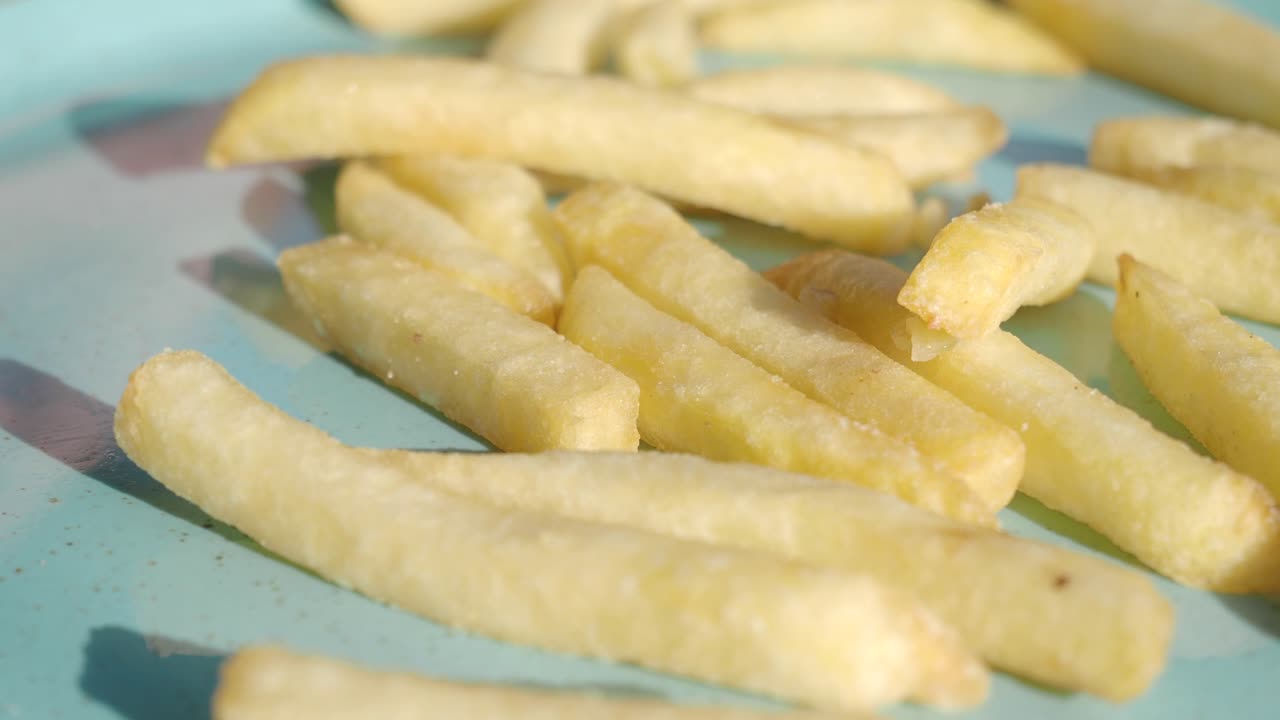 Closeup of a plate of golden french fries