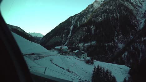 slow motion footage through the car side window while driving in the swiss alps