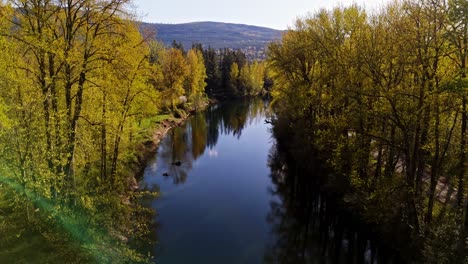 Beautiful-low-shot-view-of-calm-flowing-Snoqualmie-Middle-Fork-River-in-North-Bend,-Washington-State