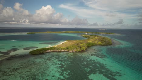 a lush tropical island surrounded by vibrant turquoise waters, aerial view