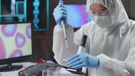 asian doctor is doing a science experiments and developing vaccine in a modern laboratory. genetic engineers workplace. the concept of science and medicine