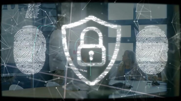 Team tapping laptop on TARGET ONLINE shield activating reforming over clear overlay securing data