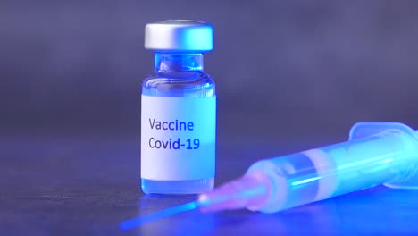 covid-19 vaccine and syringe