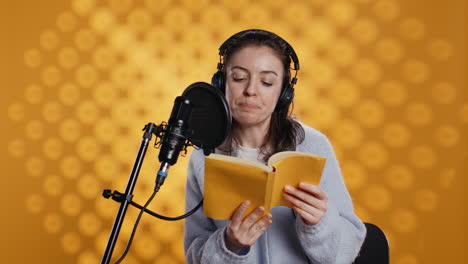 narrator reading from book into mic, exhaling after finally finishing job