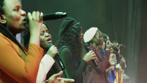 female choir singing on stage