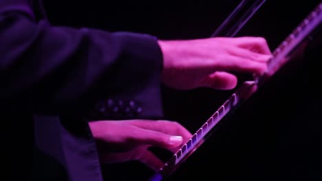 hands playing piano during a music festival