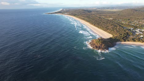 panoramic view over norries head at cabarita beach in new south wales, australia - drone shot