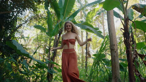 nature woman dancing in forest enjoying dance with spin in lush tropical jungle 4k